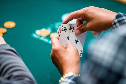 over-the shoulder view of a four-card omaha poker hand